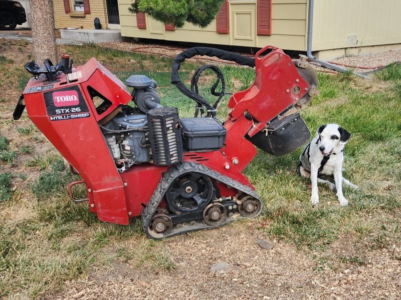 Toro STX-26 stump grinder on a job site with the TerraPro dog